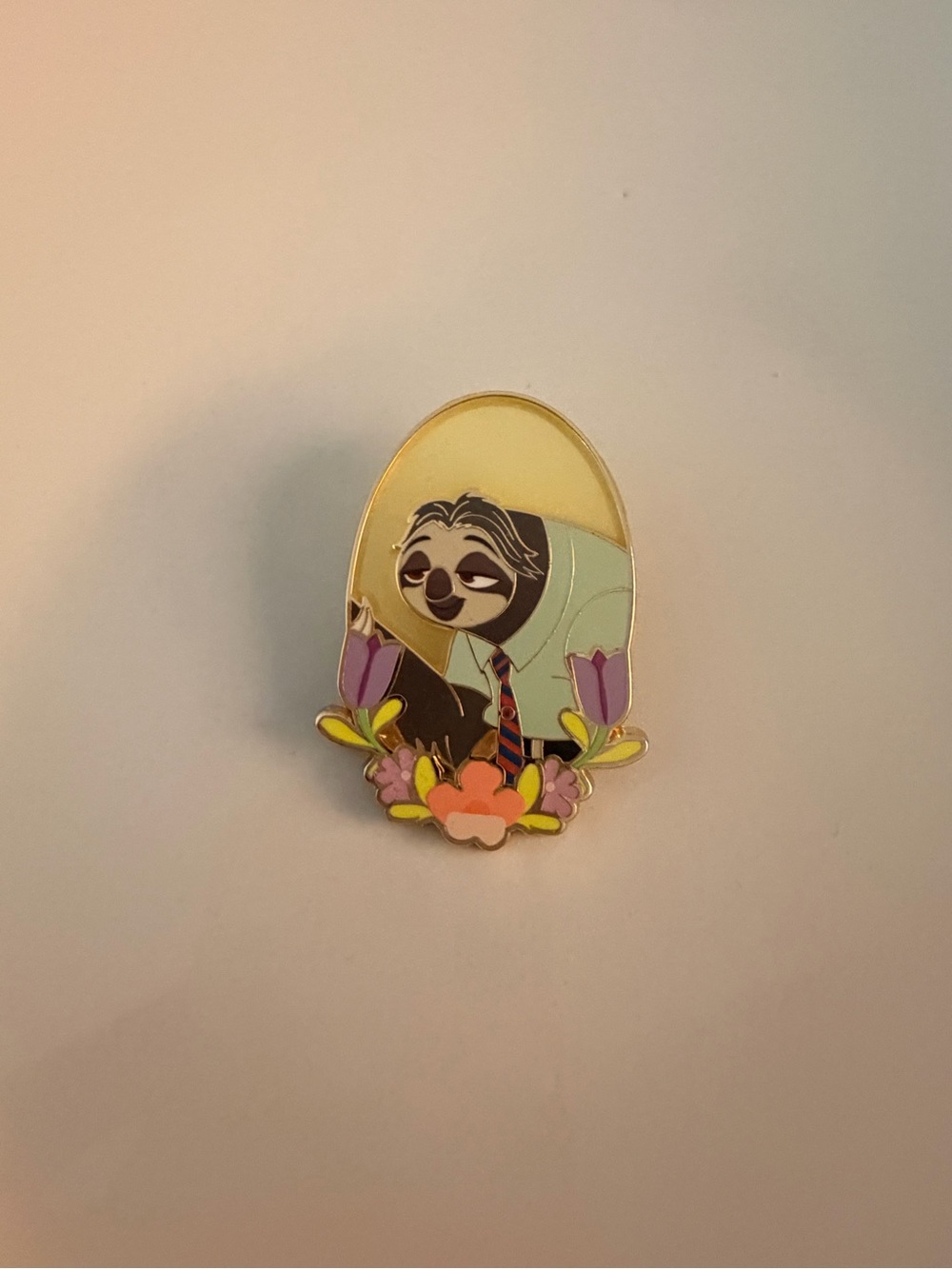 Disney Zootopia themed pin featuring the character Flash